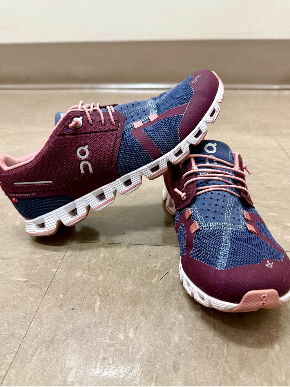 On Running Women's Athletic Shoes in Navy and Burgundy with Pink Accents
